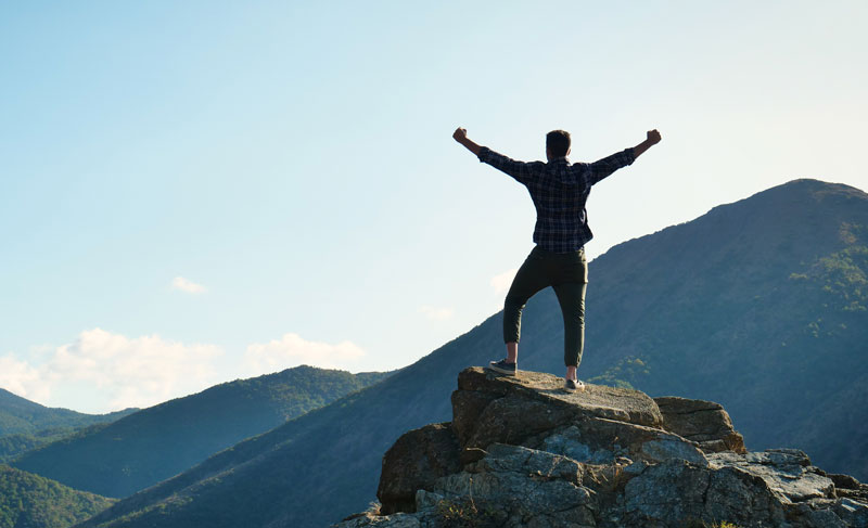 Man celebrating in nature