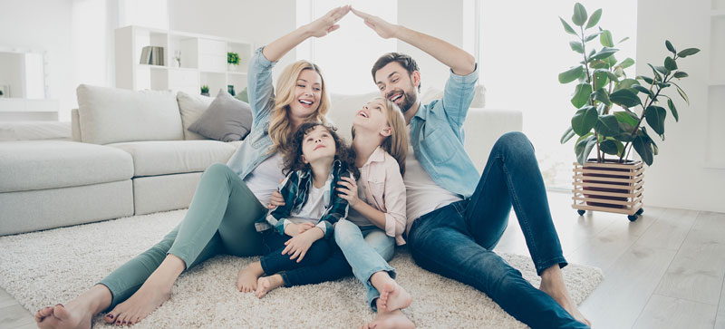 Family in their living room, happy.