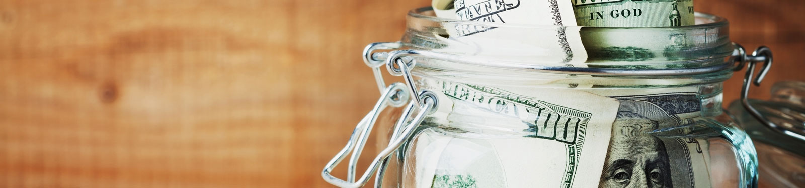 Jar of money as an emergency fund so that you have savings set aside for unexpected expenses.