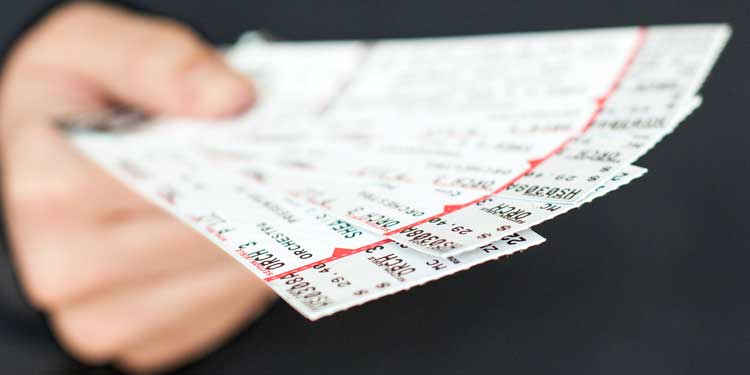 buying tickets to a sporting event, concert, or other performance