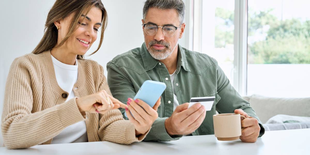 Couple reviewing debt consolidation loans as a way to pay off multiple existing debts.