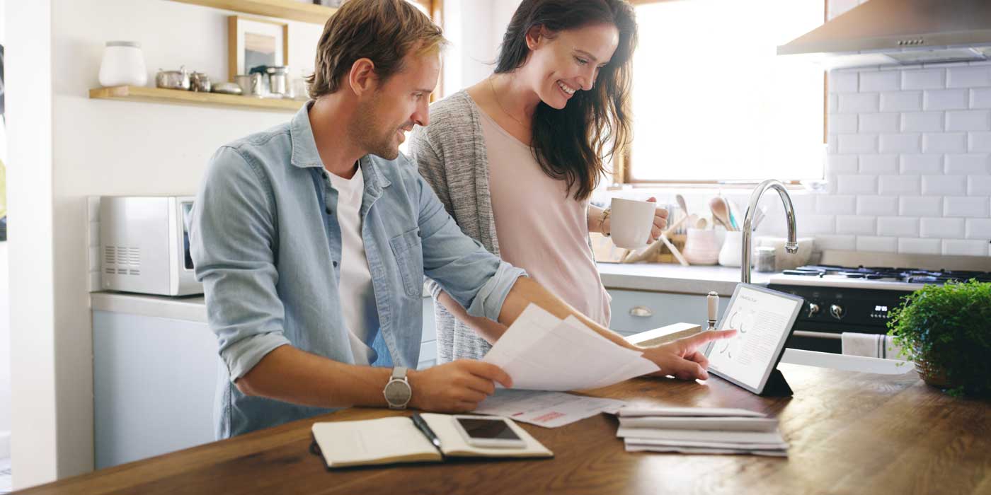 A couple learning what Debt-to-Income Ratio is and how it can benefit them financially