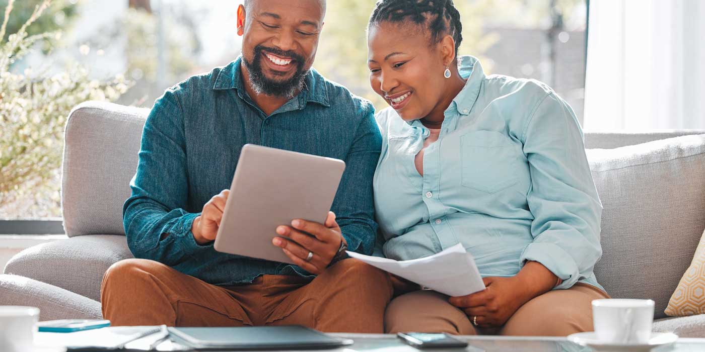 Couple researching the basics of loans to make better financial decisions.